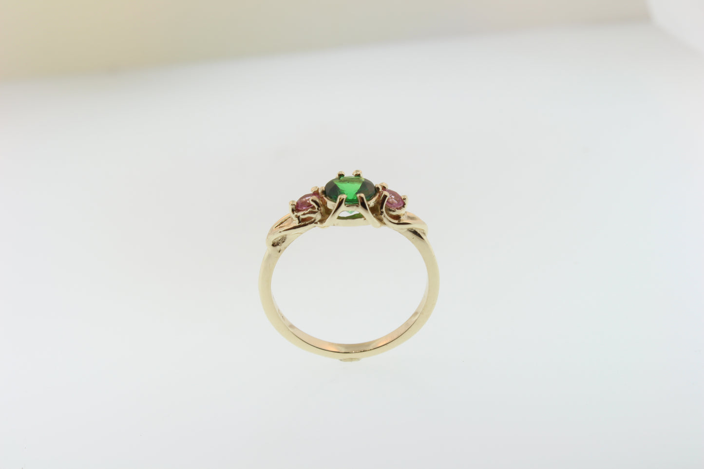 Brilliant Green Garnet and pink Sapphire ring. Set in 14k recycled yellow gold.