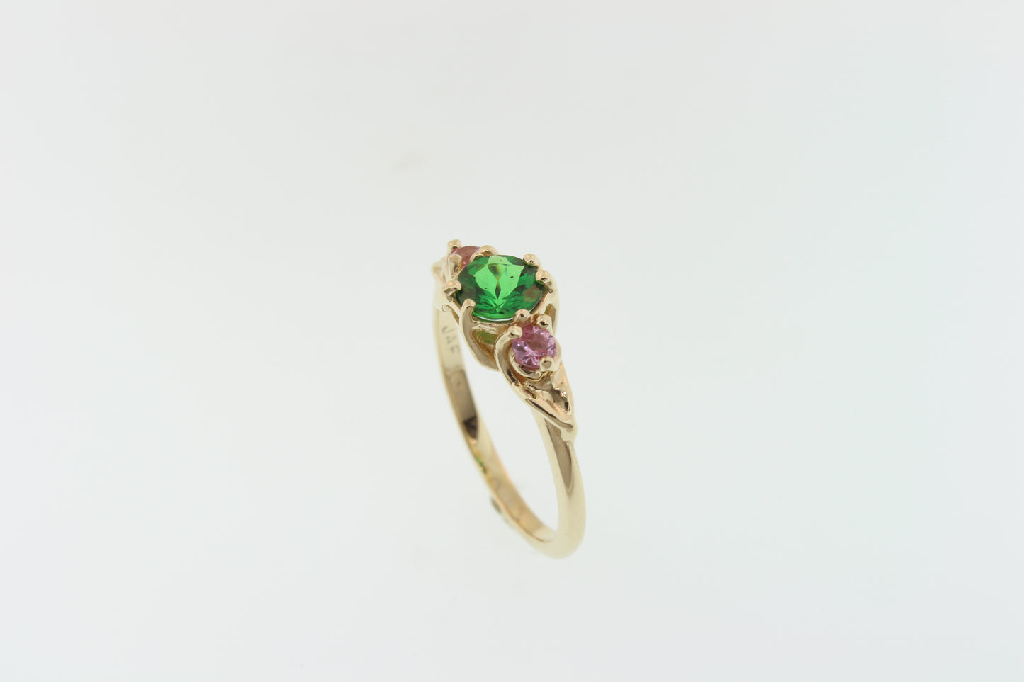 Brilliant Green Garnet and pink Sapphire ring. Set in 14k recycled yellow gold.