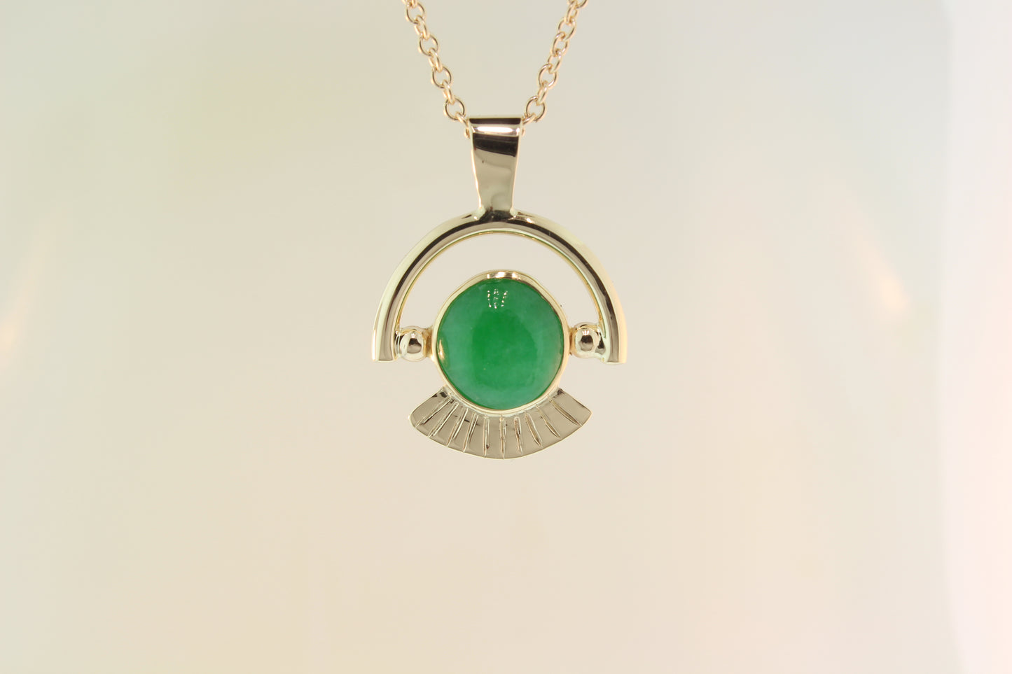 Jadeite set in yellow gold pendant